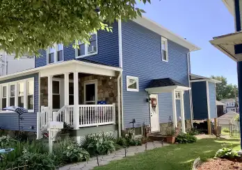 blue  vinyl siding installation on residential home in Blakely