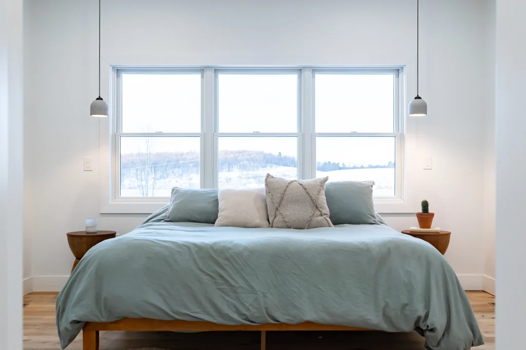 Bedroom with triple windows in new home construction