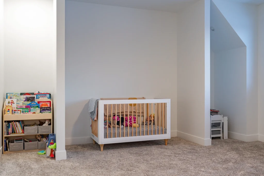 bed room with crib in new home construction